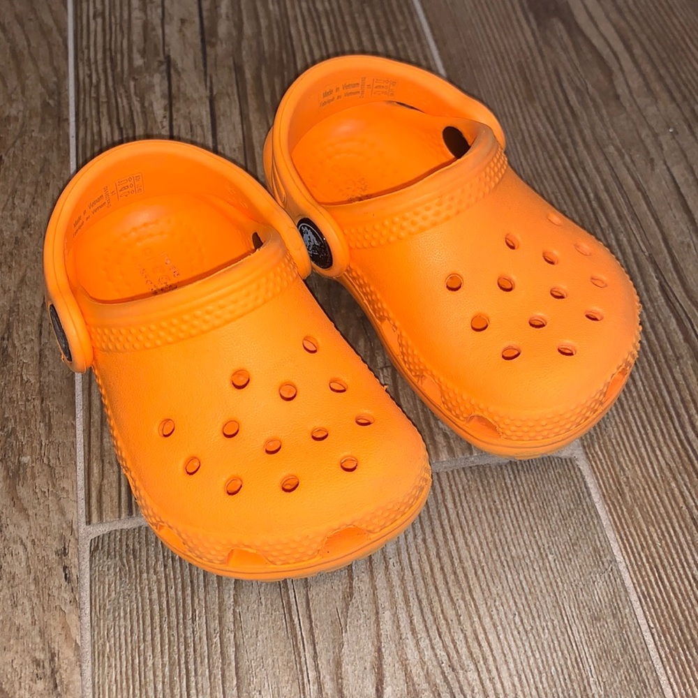 Baby/Toddler orange crocs size 4